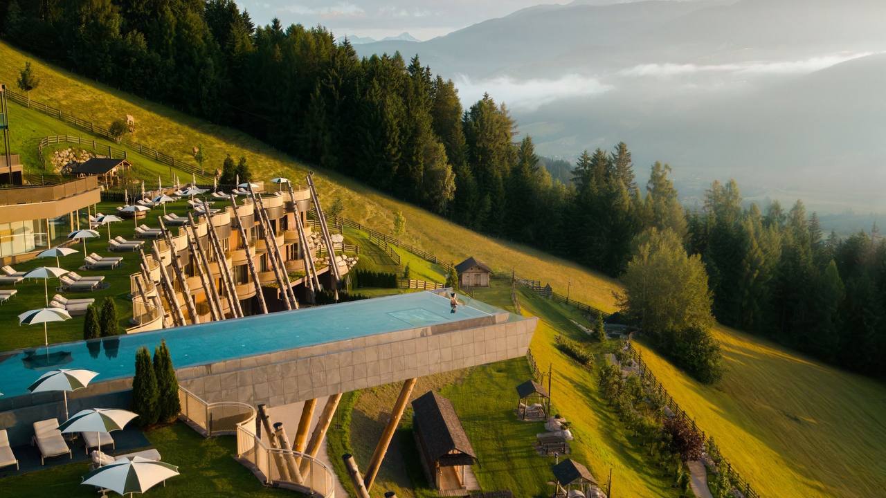 Alpine resort with cantilevered infinity pool